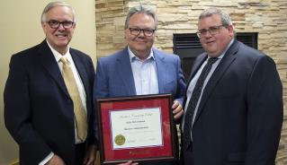 (L to R): Assiniboine Community College Board of Governors Chair Jeff Harwood, Honorary Diploma Recipient Kelly McCrimmon, and Assiniboine President Mark Frison, pictured June 2019.