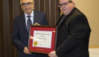 Phil Fontaine accepts an Honorary Diploma in Community Development from President Mark Frison at Assiniboine's Graduation Ceremony on June 1, 2017.
