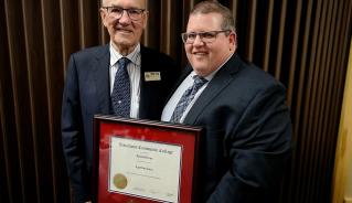 Ron Helwer accepts an Honorary Diploma in Agribusiness from President Mark Frison on June 14, 2018.