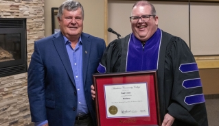 (L to R): Paul Crane (Honorary Diploma recipient) and Assiniboine President Mark Frison, pictured June 2022.
