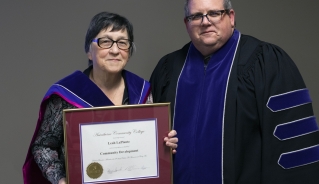 (L to R): Leah LaPlante (Honorary Diploma recipient) and Assiniboine President Mark Frison, pictured October 2022.