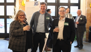 Three Assiniboine College alumni at the New Graduate Mixer in Brandon's Firehall event venue.