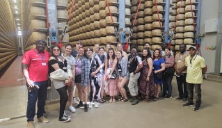 Italy group at parmesan cheese factory