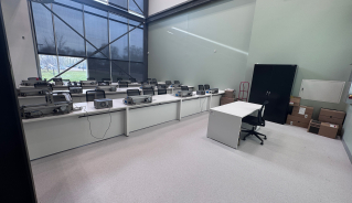 Mechatronics lab in the Len Evans building with rows of seats and electronic components on the desks.