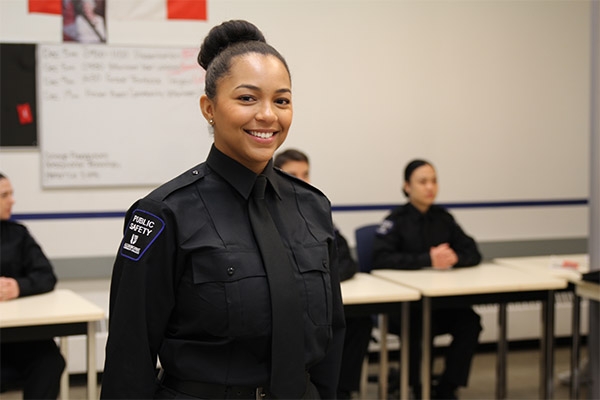 Ravyn Duncan Ravyn Duncan standing in a classroom in her Public Safety uniform