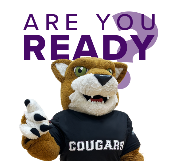 Assiniboine's mascot Caccey the cougar looking at the camera with their right paw raised, above Caccey the purple text says "Are you ready".