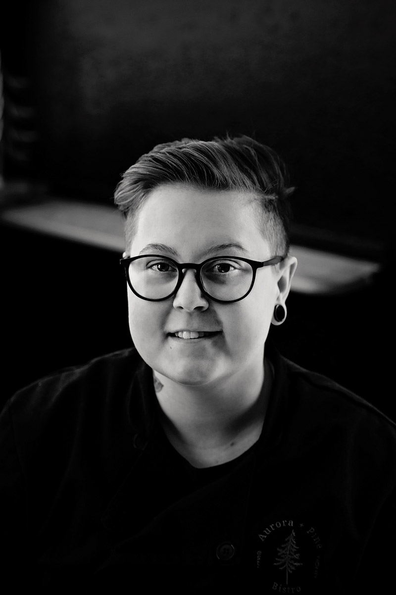 A black-and-white portrait of Kelsie Gardner.