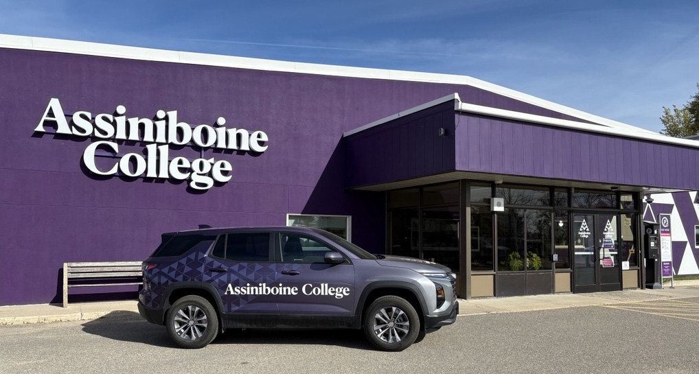 Assiniboine's Parkland Campus building in Dauphin with new purple paint and branding.