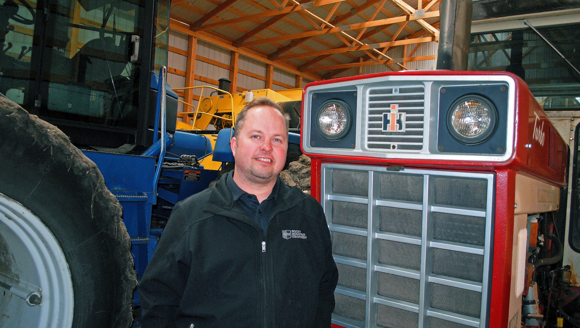Matt Kozak and a tractor in his shed