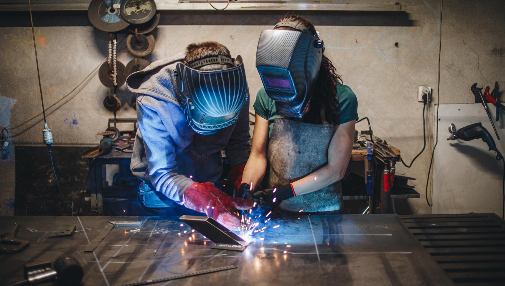 Two welding students in the shop
