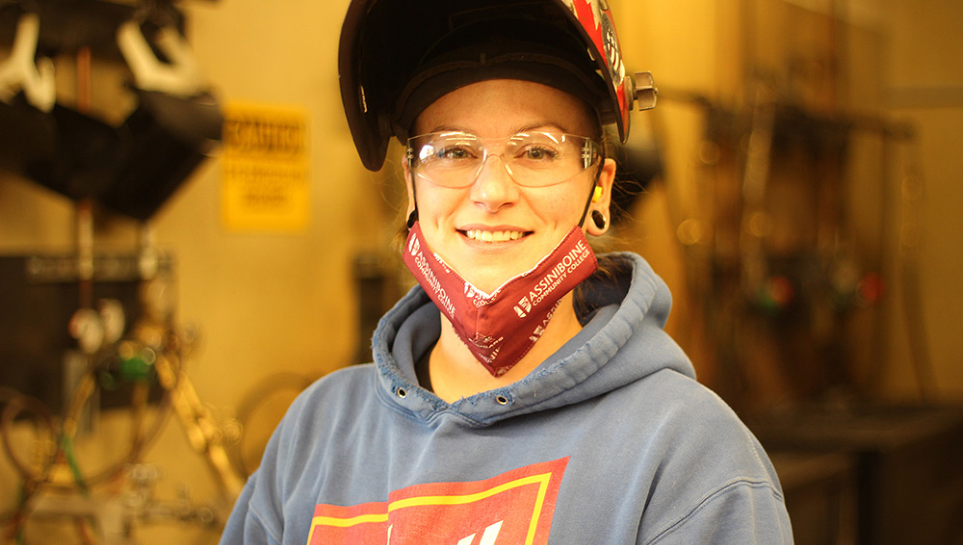 Heather Bruederlin profile photo in welding shop.