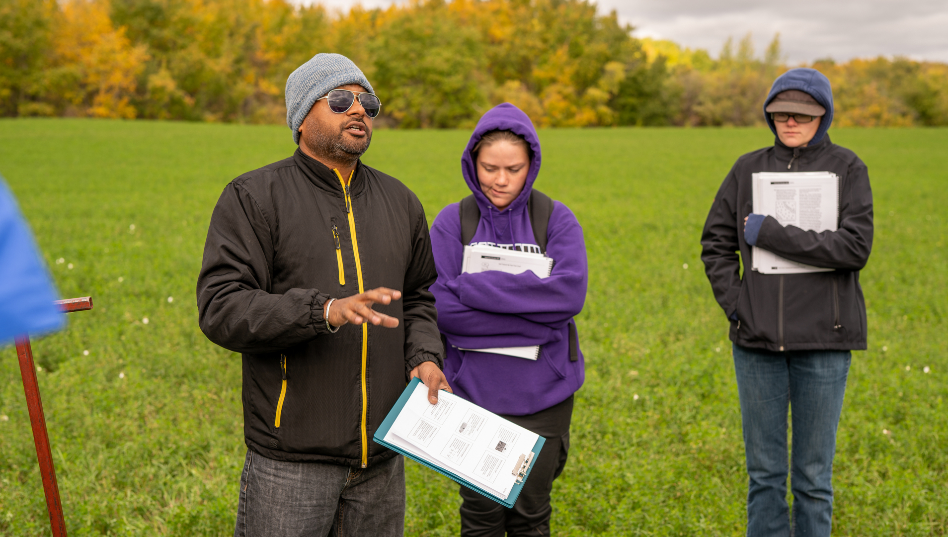 Dr. Baljeet Singh teaches first year Agribusiness students in the field. 