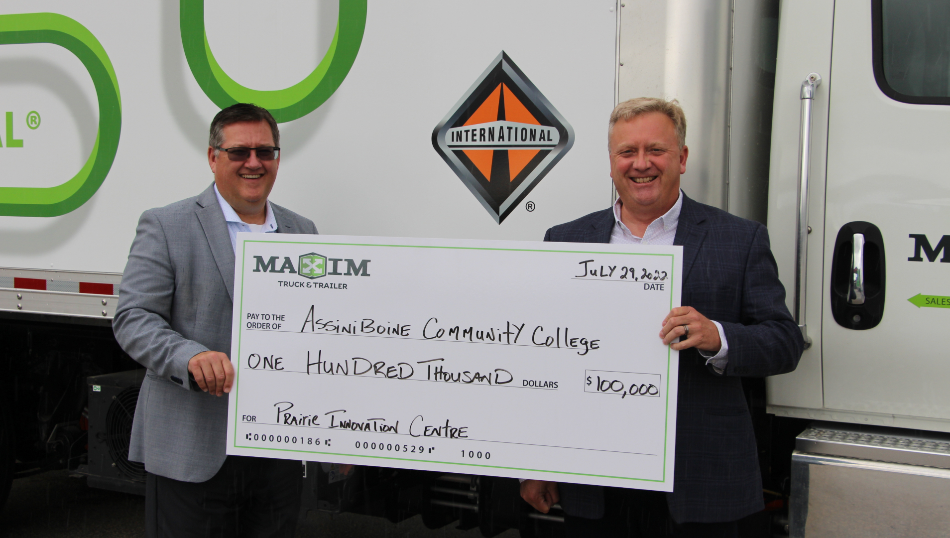 Troy Hamilton, President of Maxim Truck & Trailer with Derrick Turner, Director of Advancement & External Relations at Assiniboine