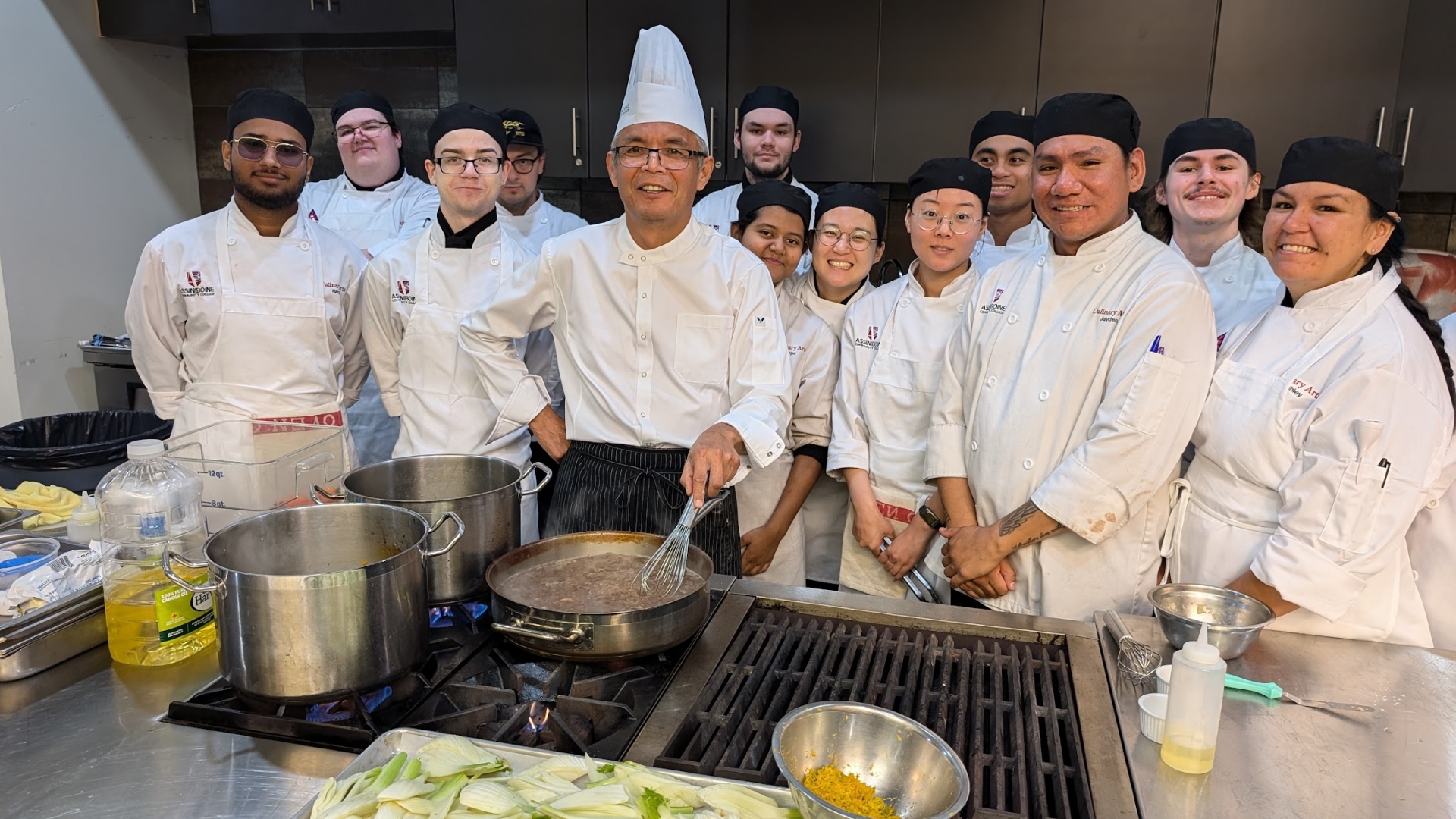 Chef Andrew George with culinary arts students at MICA