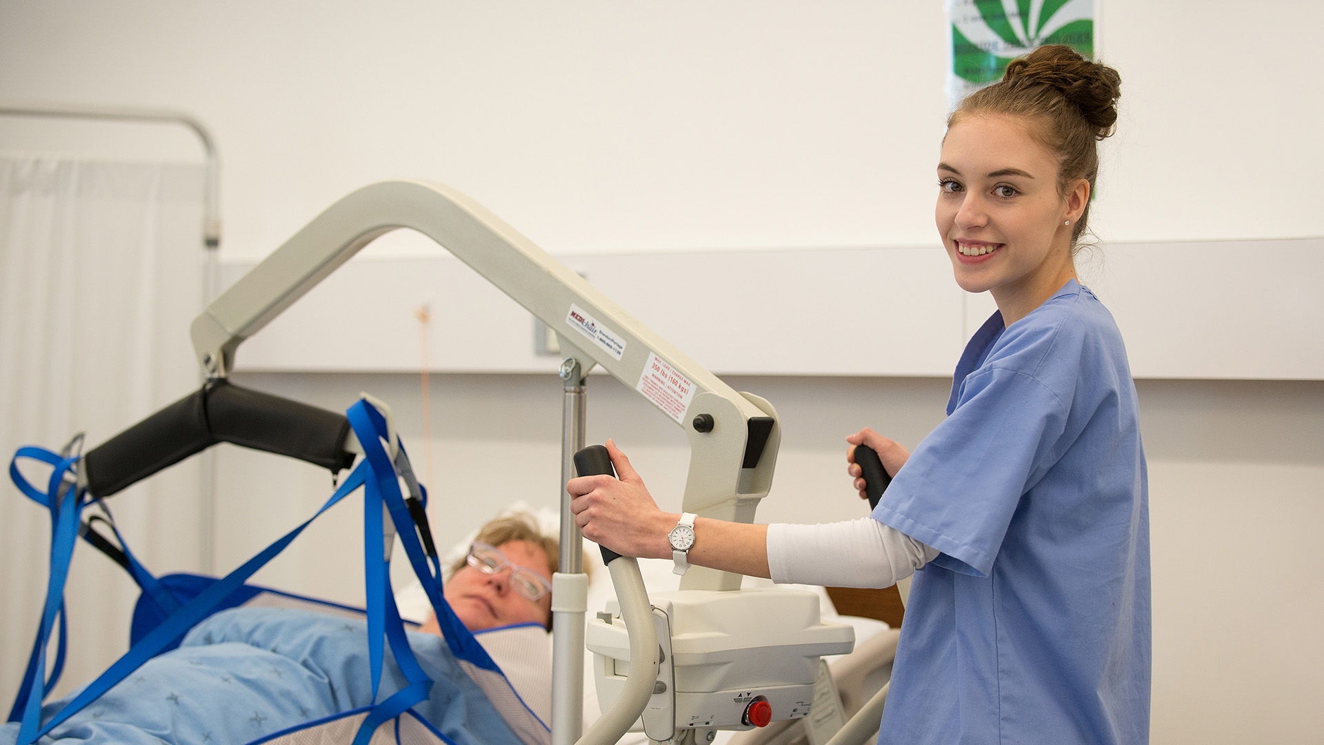 Comprehensive Health Care Aide student working with a patient.