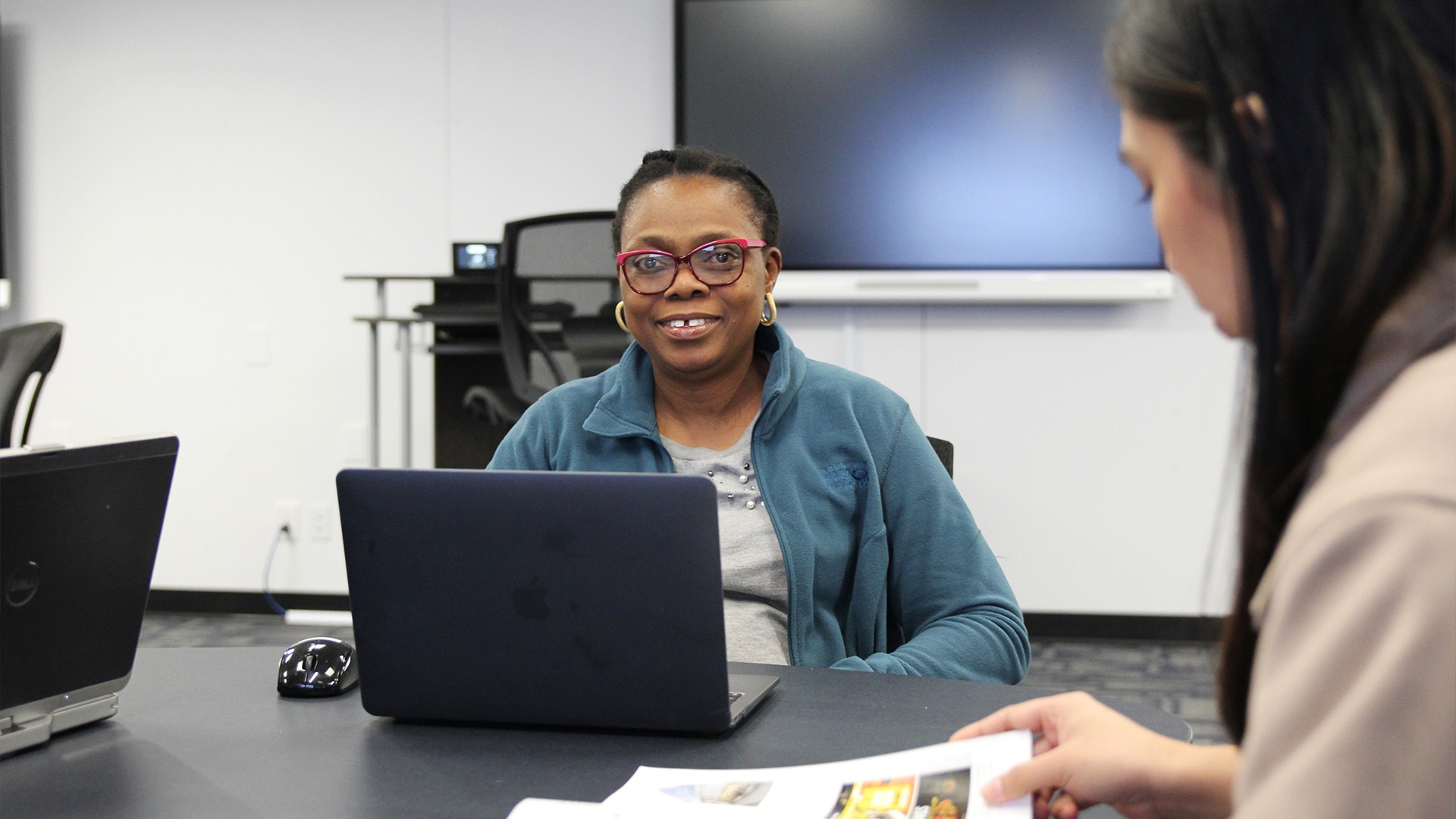An accounting student sitting in front of a laptop at Assiniboine's Westoba Lab.
