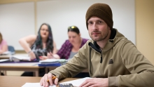 A student sitting in a classroom.