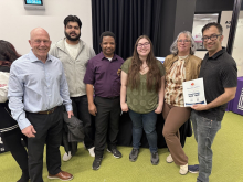 Chairperson of Brandon Salutes Barry Cooper along with board members of Brandon Salutes with Assiniboine College students