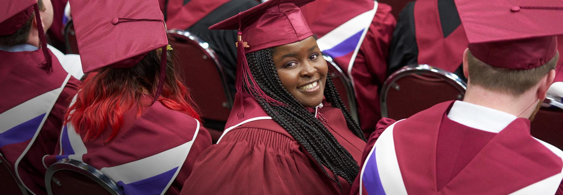 Graduate looking at camera during ceremony