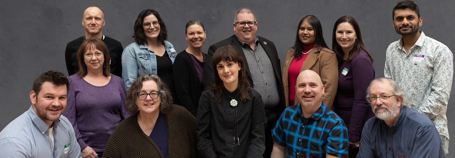 Staff members posing for a group photo.
