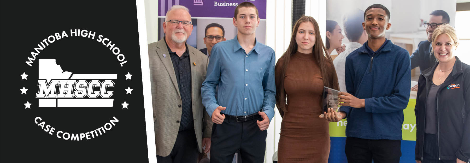 Three students standing in front of Peters School and Fusion Credit Union banners with representatives of these institutions, one of them is holding a glass award.