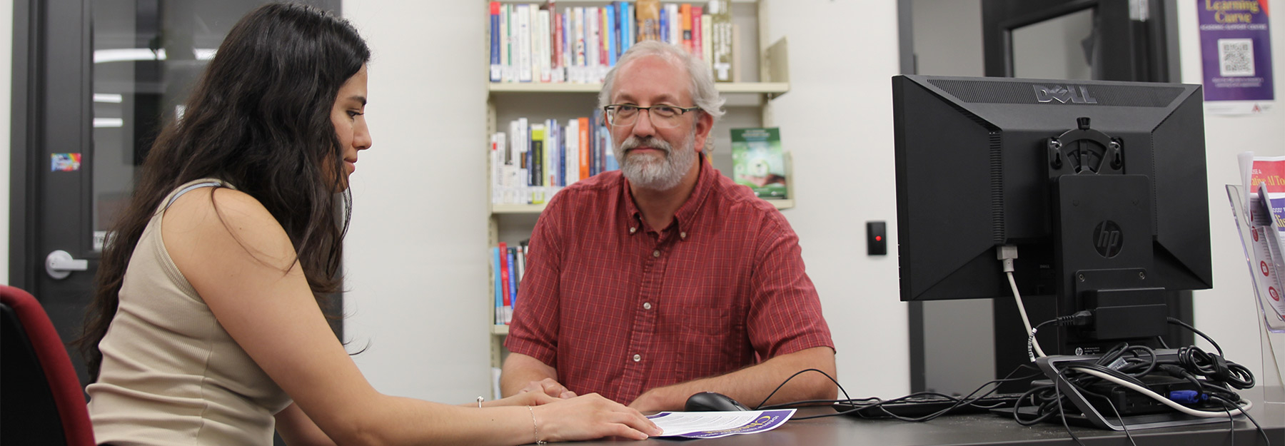 Learning Curve employee helping student.