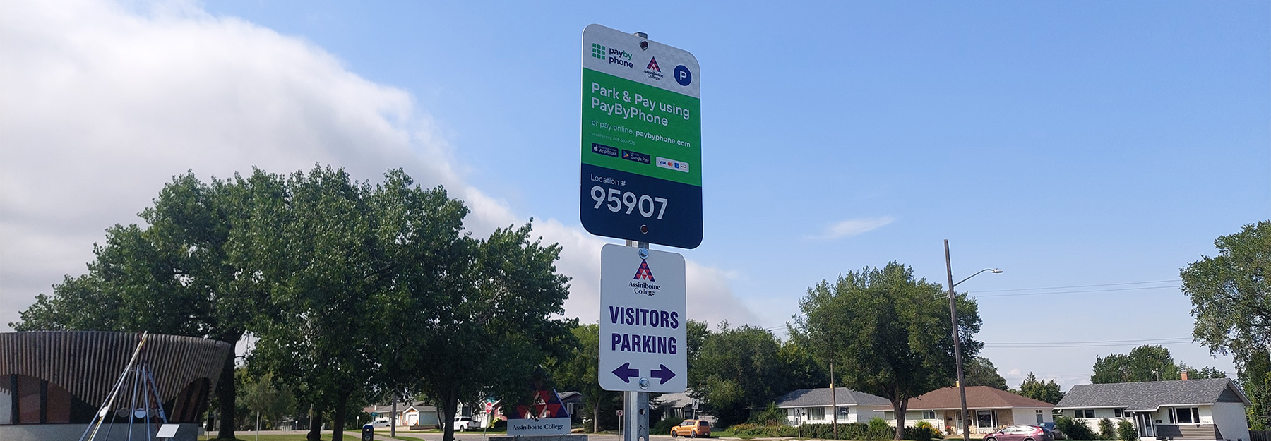 Visitor Parking sign with payment instructions.